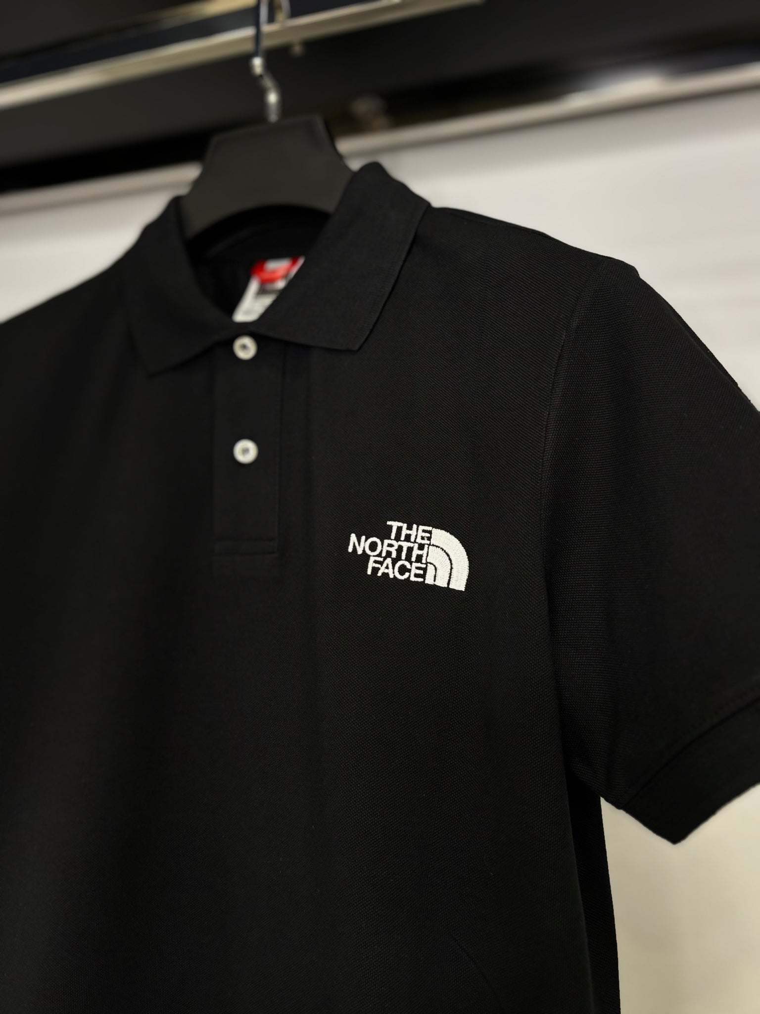 The North Face black t-shirt with collar code