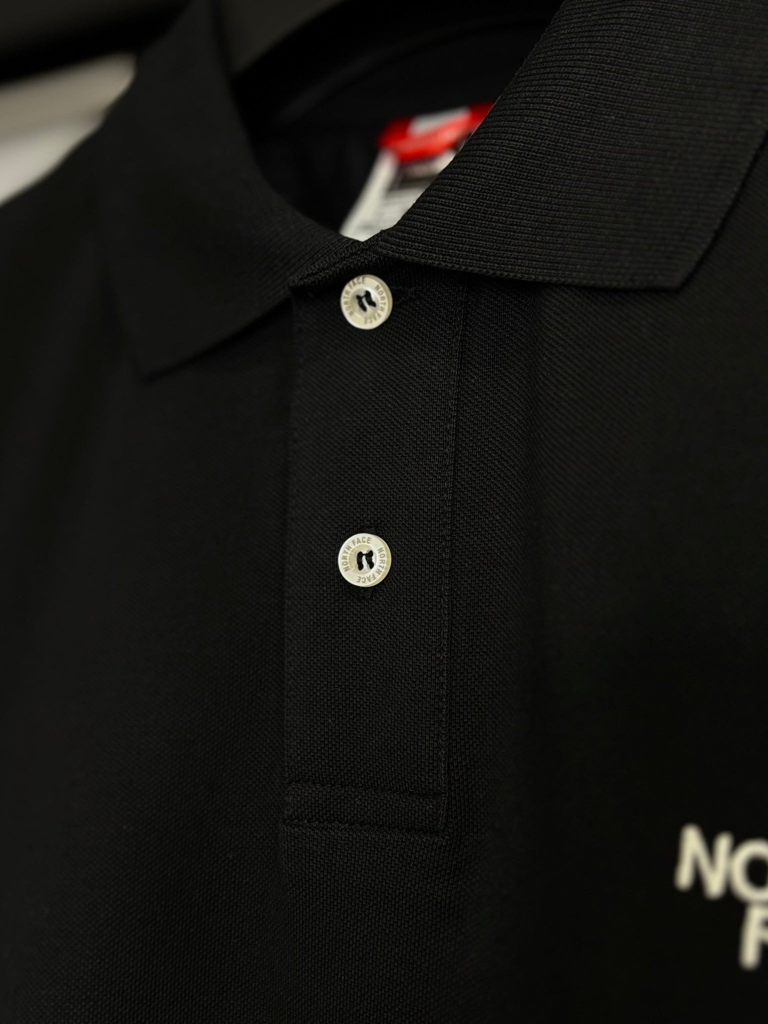 The North Face black t-shirt with collar code